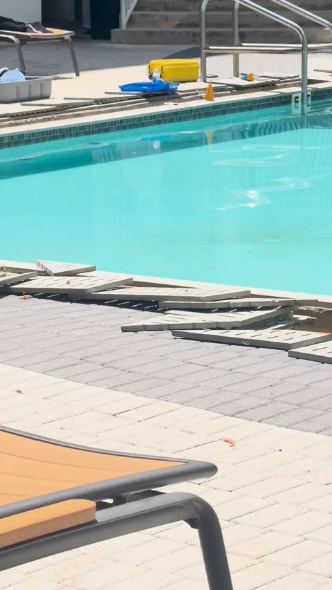 Gutter grates lifted around the pool.
