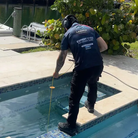 Listening for the leak with a hydrophone.