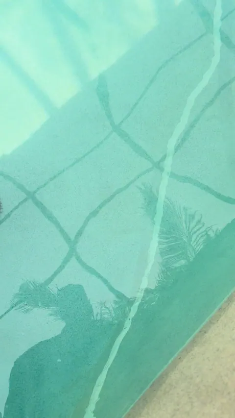 Before: Crack lines across the pool floor.