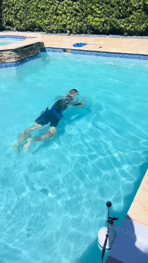 Diving the deep end to check the main drain by hand.