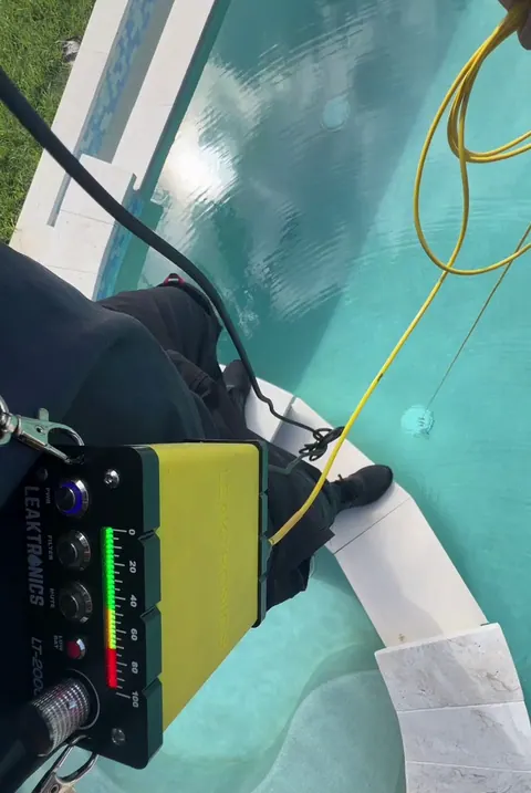 Leaktronics listening gear on deck, hydrophone cable in the water.