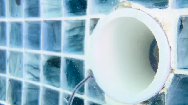 Return fitting at the pool wall, up close.